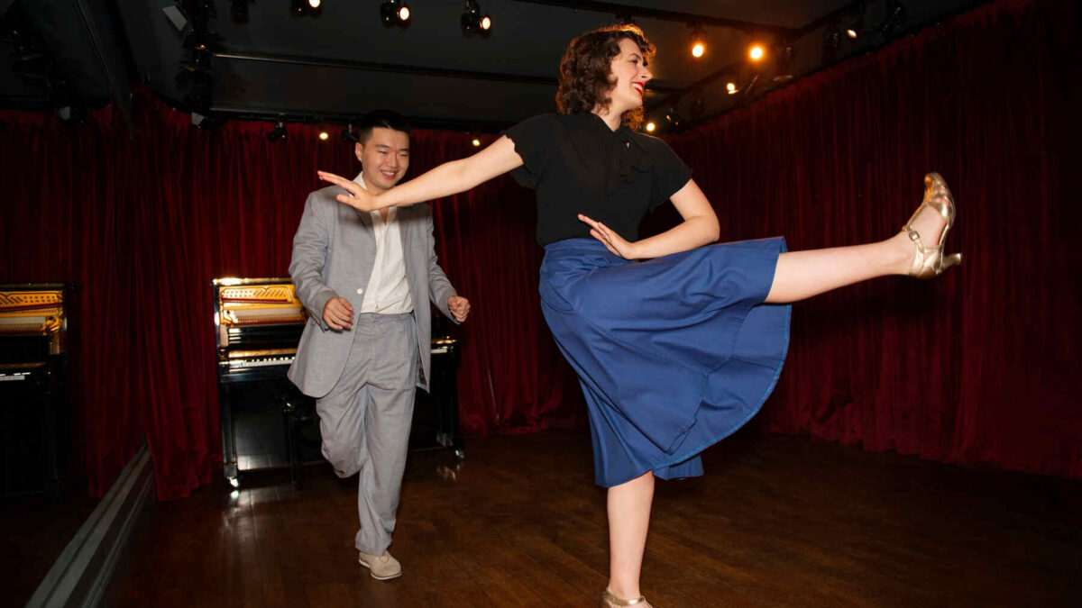 couple swing dancing to illustrate retro dance fever
