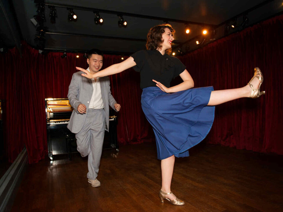 couple swing dancing to illustrate retro dance fever