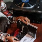 person with a booklet and turntable learning how to unlock the booth