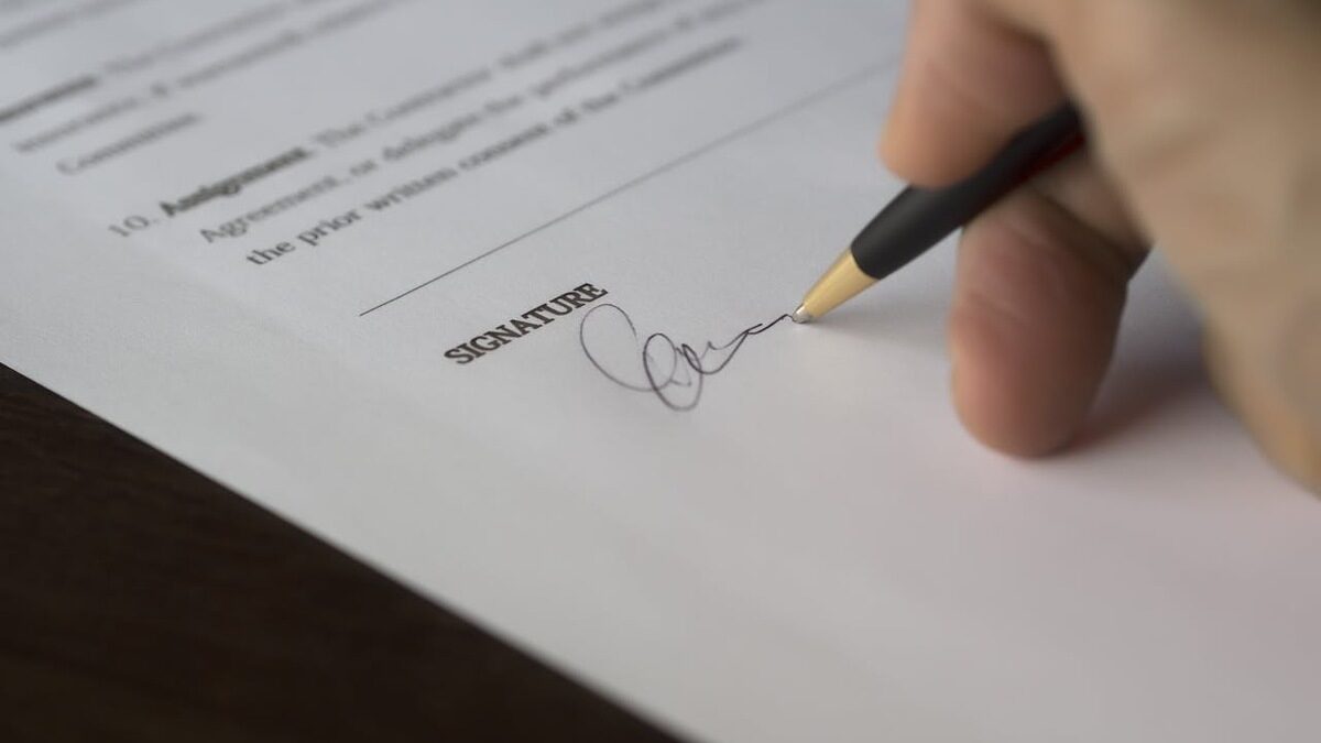 Essential Guide to DJ contracts with hand signing contract