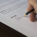 Essential Guide to DJ contracts with hand signing contract