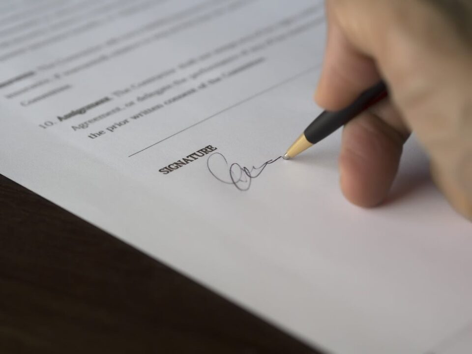 Essential Guide to DJ contracts with hand signing contract