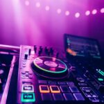 Behind-the-scenes wedding DJ setup with sound equipment, lighting, and cables being prepared before guests arrive to create the perfect atmosphere.