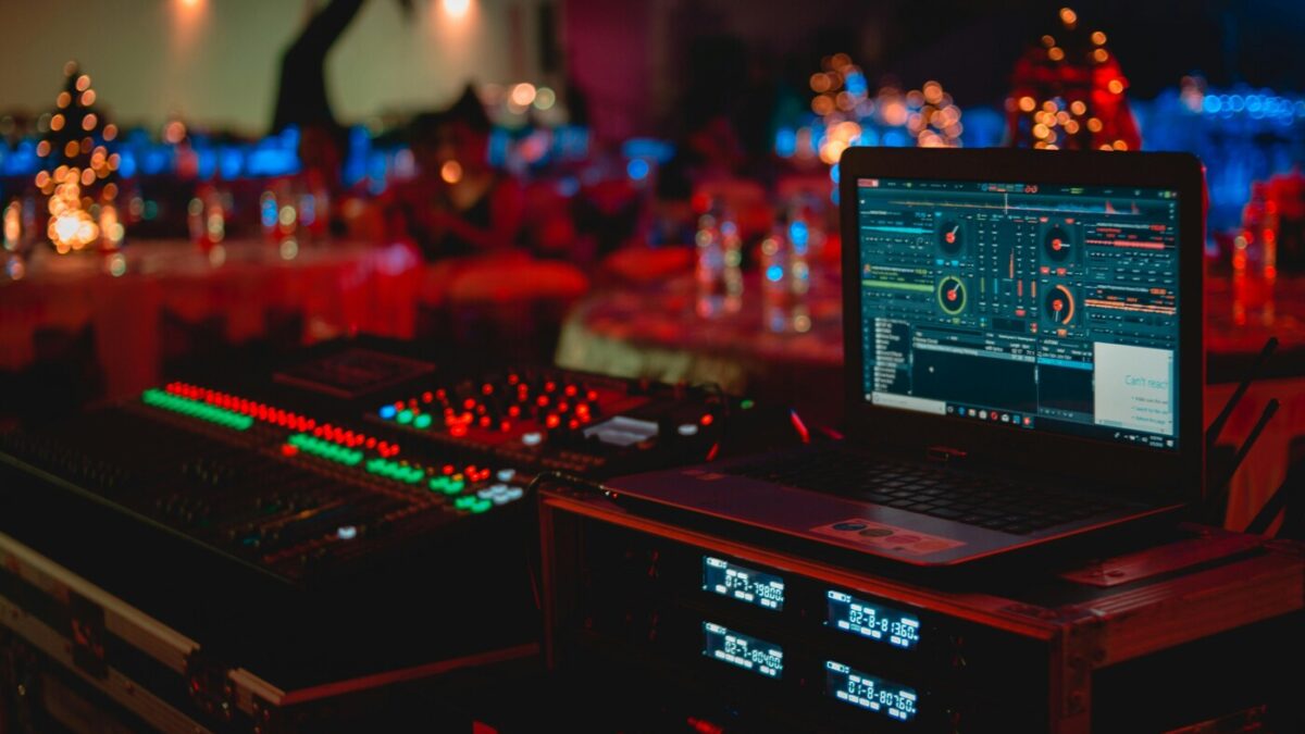 Professional DJ sound system setup with speakers and mixer at a live event venue