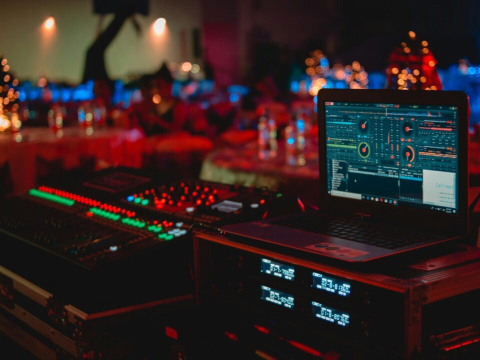 Professional DJ sound system setup with speakers and mixer at a live event venue